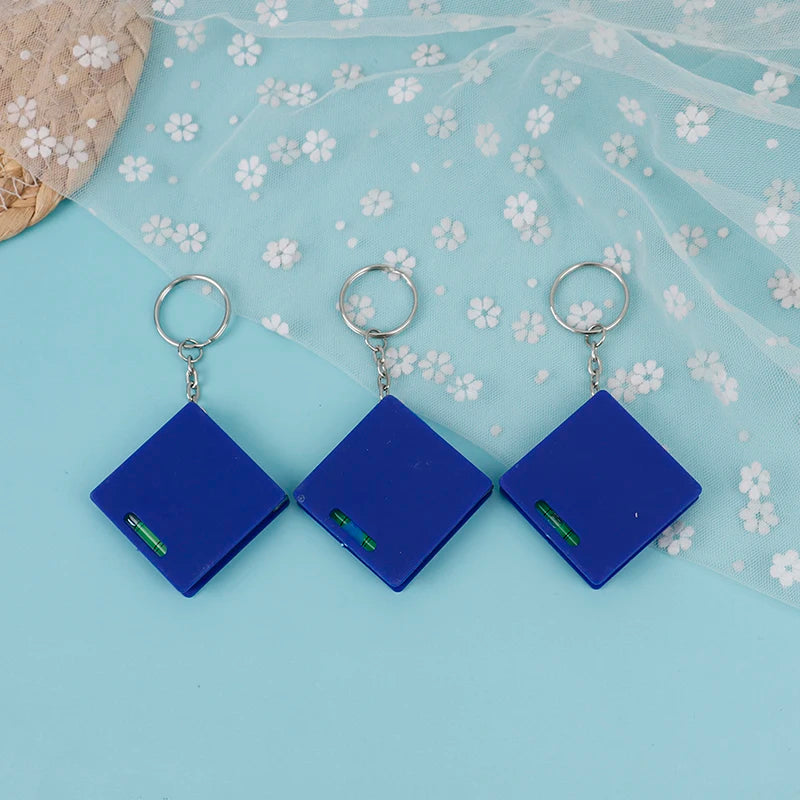 1M Mini Tape Measure Keychain With Horizontal Bubble Plastic Portable Retractable Ruler Centimeter/Inch Tape Measure 4.3*4.3*1cm Zpaxo