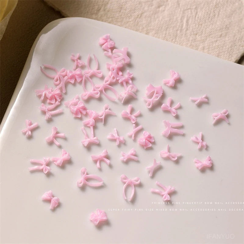 50pcs Sweet Pink Bowknot 3D Nail Art Decorations Mini Resin Ribbon Nail Rhinestones Charms Nail Accessories Manicure DIY Zpaxo